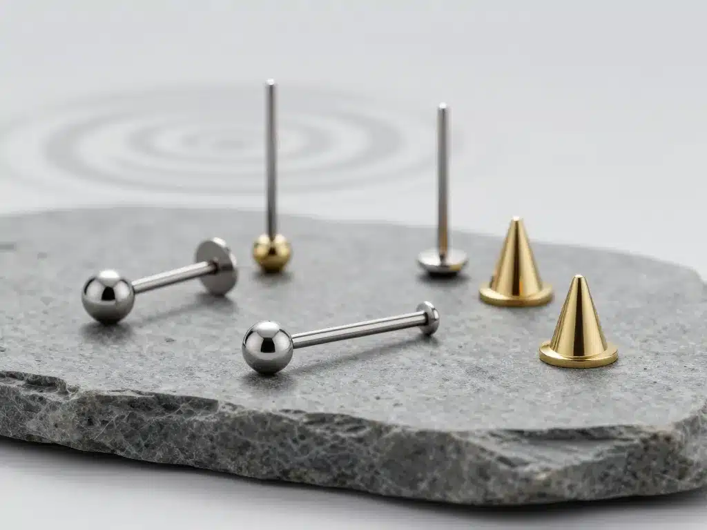 Barbells titane et or pour bridge piercing, scène produit